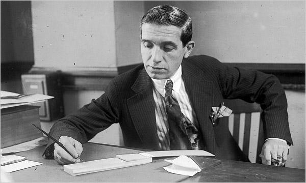 Charles Ponzi at his desk